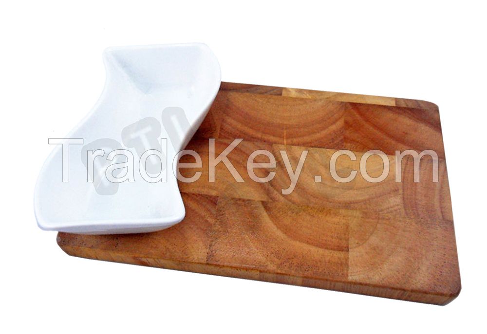 wooden cutting board with streamlined ceramic bowl