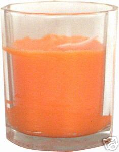 SCENTED COLORED CANDLE IN GLASS VOTIVE