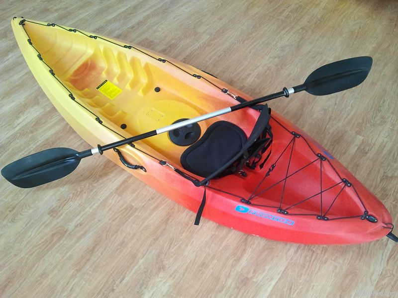 Single person sit on top fishing kayak with paddles