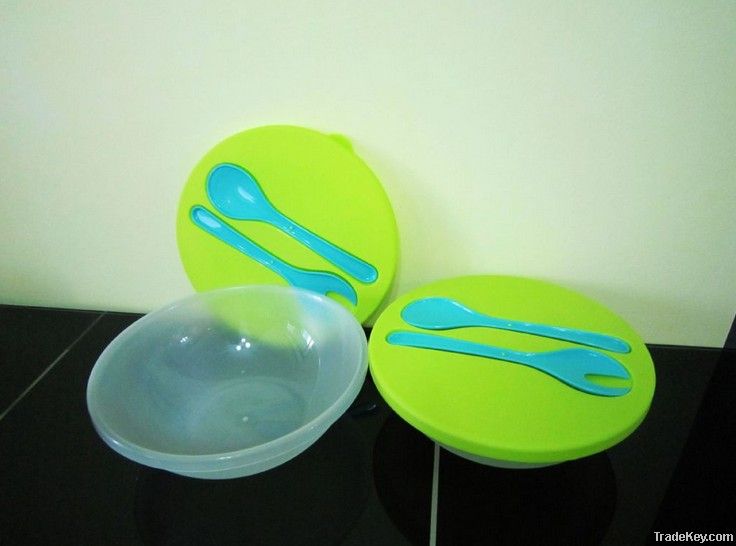 plastic salad bowl with spoon and fork