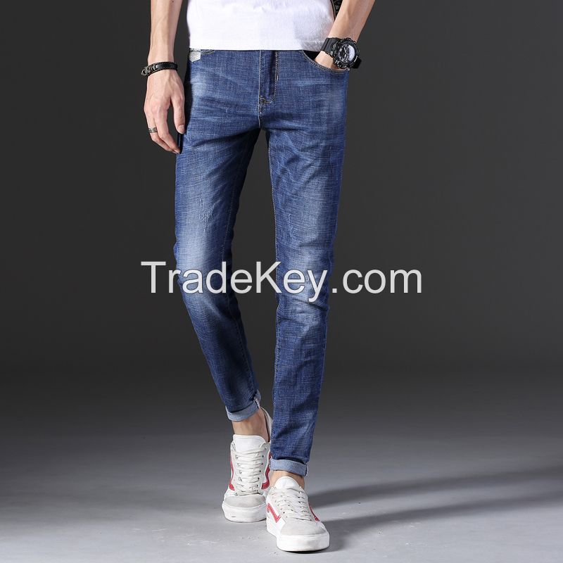 Man's fashionable dark blue ripped slim fit denim jeans