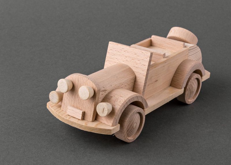 Wooden toy car made by hands.