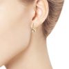Gold earrings with dia...