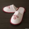 Plush hotel slippers w...