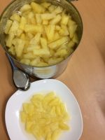 Canned pineapple tidbits cutting