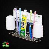 Wall mounted adhesive toothbrush