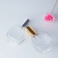 50ml Transparent Oval Shape Perfume Bottle Mist Spray Top Glass Bottle with Golden Sliver Lid