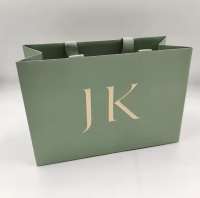 Custom Color UV Gold Foil Printed Art Paper Bag with Embossed Design for Clothing and Cosmetic Use Competitive Price