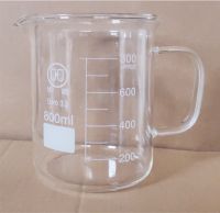 Glass beaker with hand