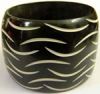 Black resin bracelet with cream stripes