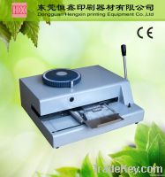 Metal tag embossing machine
