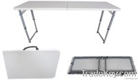 Height adjustable folding table