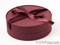 Round burgundy jewelry gift box with bow