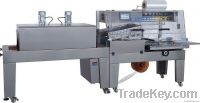 Shrink wrapping machine