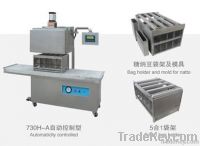 Vertical hot-vacuum packaging machine