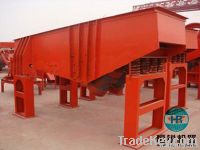 Vibrating feeder for mining ore