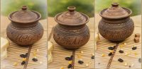 Ceramic pot with lid made of red clay. 